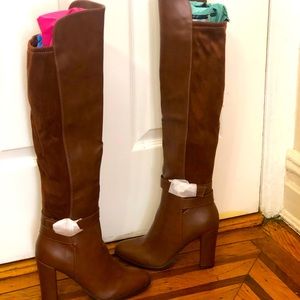 Brown heeled knee high boots